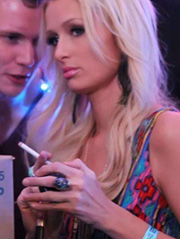 Paris Hilton seen at a club vaping